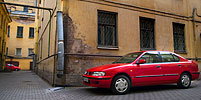 Red Cars in a Yard